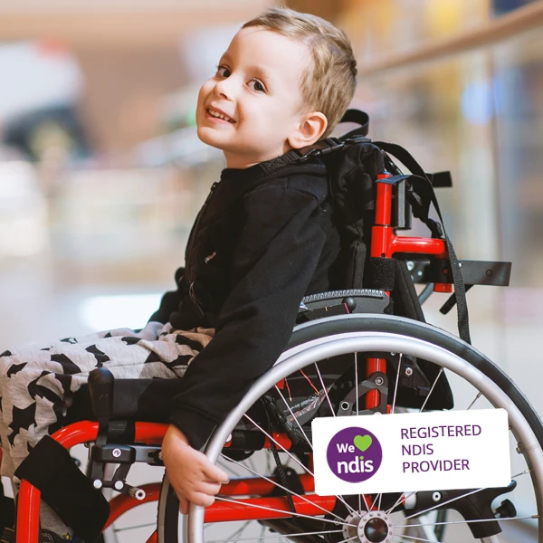 boy in wheelchair NDIS logo